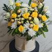 Yellow and white flower box with chocolates