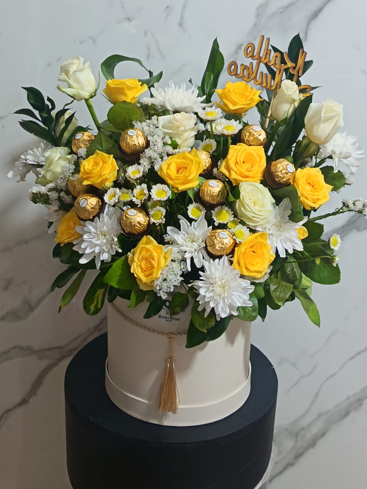 Yellow and white flower box with chocolates