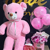 Pink teddy bear birthday gift set with flowers and balloons