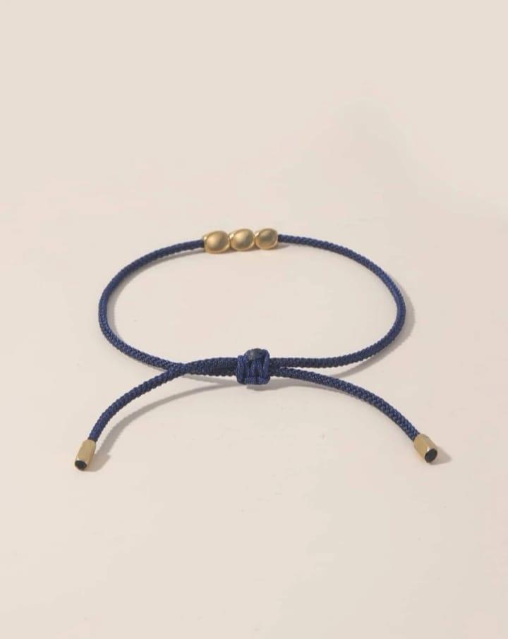 Braided bracelet with geometric decor Braided bracelet with geometric decor