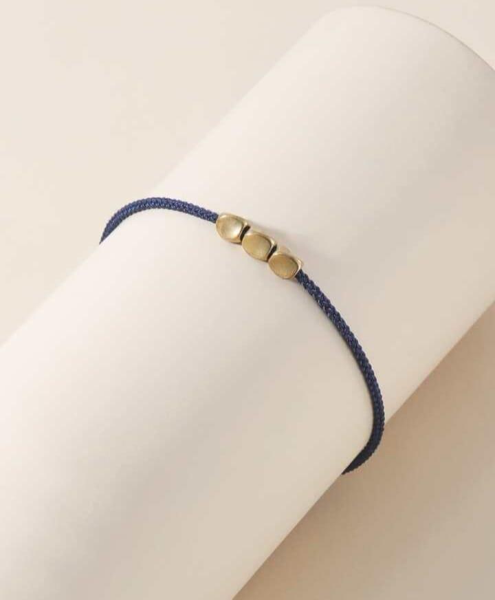 Braided bracelet with geometric decor Braided bracelet with geometric decor
