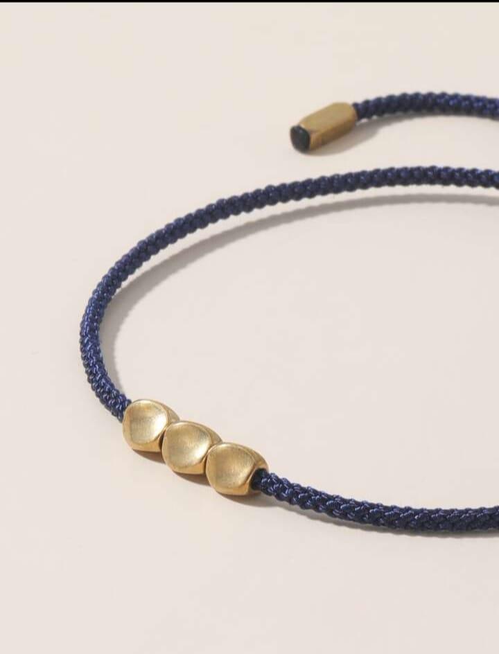 Braided bracelet with geometric decor Braided bracelet with geometric decor